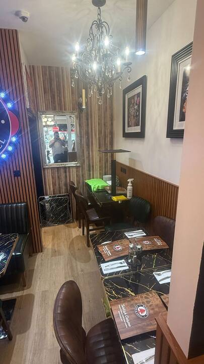 Dining corner with chandelier and marble tables