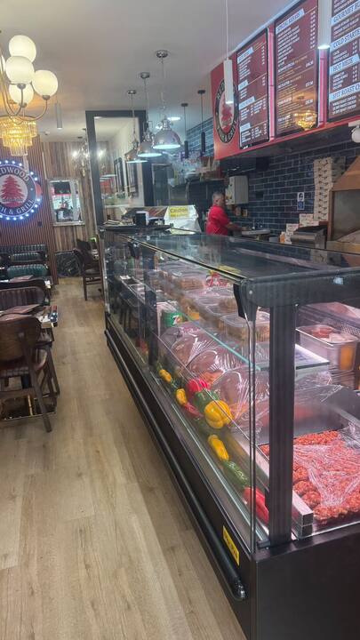 Grill counter with fresh skewers and peppers