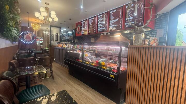 Inside Redwood: dining tables, grill counter and menu boards