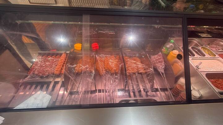 Shish and Adana kofte skewers in the chilled display